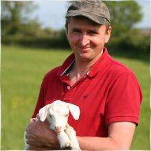 Petru, our Farm Manager and a goat kid